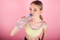 SPORTY FITNESS GIRL HOLDING BOTTLE OF WATER Royalty Free Stock Photo