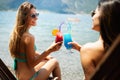 Beautiful fit girls in summer day having fun and cocktails on beach Royalty Free Stock Photo