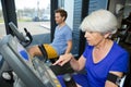 Beautiful fit senior woman in gym doing cardio work out Royalty Free Stock Photo