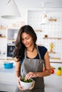 Beautiful fit woman eating healthy salad after fitness workout Royalty Free Stock Photo