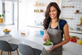 Beautiful fit woman eating healthy salad after fitness workout Royalty Free Stock Photo