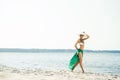 Beautiful, fit woman with perfect legs posing on the beach Royalty Free Stock Photo