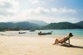 Beautiful, fit woman sunbathing in the deckchair Royalty Free Stock Photo