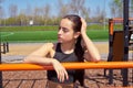 Beautiful fitness girl doing exercises in stylish sportswear  outdoors. Royalty Free Stock Photo