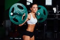 Beautiful fitness woman lifting barbell. Royalty Free Stock Photo