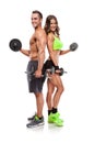 Beautiful fitness young sporty couple with dumbbell