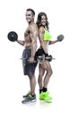 Beautiful fitness young sporty couple with dumbbell