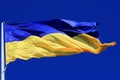 Beautiful flag of Ukraine in sky. Large Ukrainian flag flutters, the concept of struggle of Ukraine people against war of Russia.