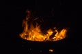 Beautiful flame with sparks in bonfire in the night. Heat and danger energy concept. Fire on black background. Royalty Free Stock Photo