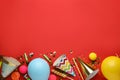 Beautiful flat lay composition with festive items on red background, space for text. Surprise party concept Royalty Free Stock Photo