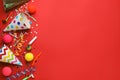 Beautiful flat lay composition with festive items on red background, space for text. Surprise party concept Royalty Free Stock Photo