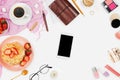 Beautiful flatlay arrangement with cup of coffee, hot waffles with cream and strawberries, smartphone with copyspace and beauty ac