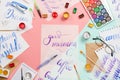 Beautiful flatlay arrangement with watercolors, brushes, glasses, brushpen, paints with good morning handlettering and other stati Royalty Free Stock Photo