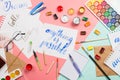 Beautiful flatlay arrangement with watercolors, brushes, glasses, brushpen, paints with handlettered sign anything is possible and Royalty Free Stock Photo