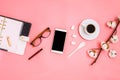 Beautiful flatlay with cup of espresso, cotton branch, sugar cubes, smartphone and planner Royalty Free Stock Photo
