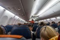 Beautiful flight attendants explain to passengers how to use
