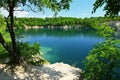 Beautiful flooded quarry with clear water for swimming. Summer landscape concept with nature. Masovice - Czech Republic