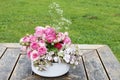 Beautiful floral arrangement with pink roses, hortensia and gypsophila paniculata Royalty Free Stock Photo