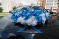 Beautiful floral decoration is on a wedding car. Royalty Free Stock Photo