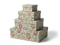 Beautiful floral gift boxes stacked in pyramid shape on white background Royalty Free Stock Photo