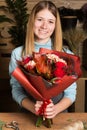 Female florist with bunch of autumn flowers Royalty Free Stock Photo