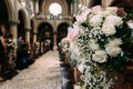 Beautiful flower bouquet decoration for wedding in a church with blur background Royalty Free Stock Photo