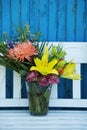 Beautiful flower bouquet on a garden bench Royalty Free Stock Photo