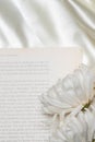 Beautiful flower concept, White chrysanthemum on the books over white cloth background Royalty Free Stock Photo