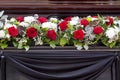 Beautiful flower decoration of the coffin. Funeral, farewell ceremony Royalty Free Stock Photo