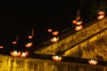 Beautiful flower garlands and colored lanterns on ancient architectural building