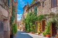 Beautiful flower street in a medieval village in Tuscany.