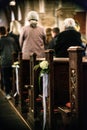 Beautiful flower wedding decoration in a church hang on the seat rows setting in the Chapel, ceremony selective focus Royalty Free Stock Photo