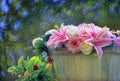 beautiful flowers arrangement in wood bucket with blurry background Royalty Free Stock Photo