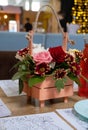 Beautiful flowers in a basket in the cafe