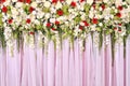 Beautiful flowers blossom on pink curtain