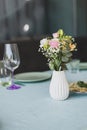 Beautiful flowers decorated on the table.Tables set for an event party or wedding reception. Royalty Free Stock Photo