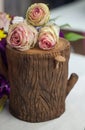 Beautiful flowers decoration on the tree stump. Royalty Free Stock Photo