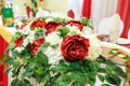 Beautiful flowers on elegant dinner table in wedding day. Decorations served on the festive table in blurred background Royalty Free Stock Photo