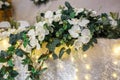 Beautiful flowers on elegant dinner table in wedding day. Decorations served on the festive table in blurred background Royalty Free Stock Photo