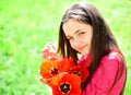 Beautiful flowers for every moment. Pretty girl with flower bouquet. Little girl with flowers bloom. Cute child with red