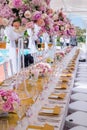 Beautiful flowers and glasses in roll romantic wedding table decorations