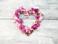 beautiful flowers heart shape for valentine on wood background Royalty Free Stock Photo