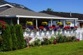 Beautiful flowers surround a suburban house