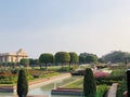 Beautiful flowers and trees near a water fountain in Mughal Gardens, India