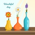 Beautiful flowers in vases, stand on the windowsill under the sun.