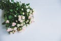 Beautiful flowers on white background. Roses bouquet. Perfect flat lay. Happy mother`s holiday postcard. International women`s d