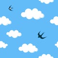 Flying swallows in the blue sky with white clouds seamless pattern Royalty Free Stock Photo