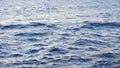 Beautiful flying seagulls above the ripples of the blue sea against cloudy sky. Stock. Minimal seascape with white Royalty Free Stock Photo