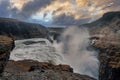 Beautiful foggy cascades of Gullfoss waterfall in Golden Circle during sunset Royalty Free Stock Photo