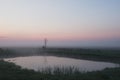 Beautiful foggy sunrise in Ukraine. Fog on the field. Untouched nature